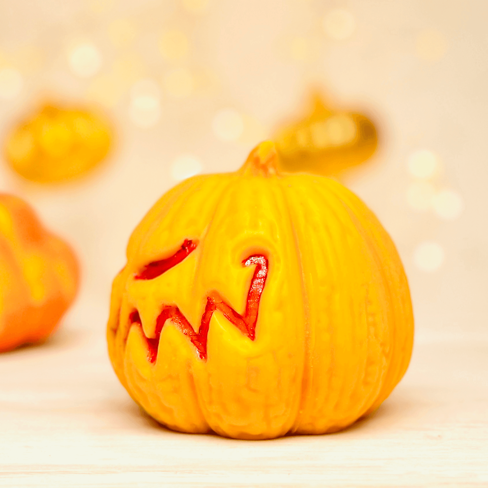 Jack-O-Lantern silicone candle mold creating a spooky pumpkin candle, perfect for Halloween decor.