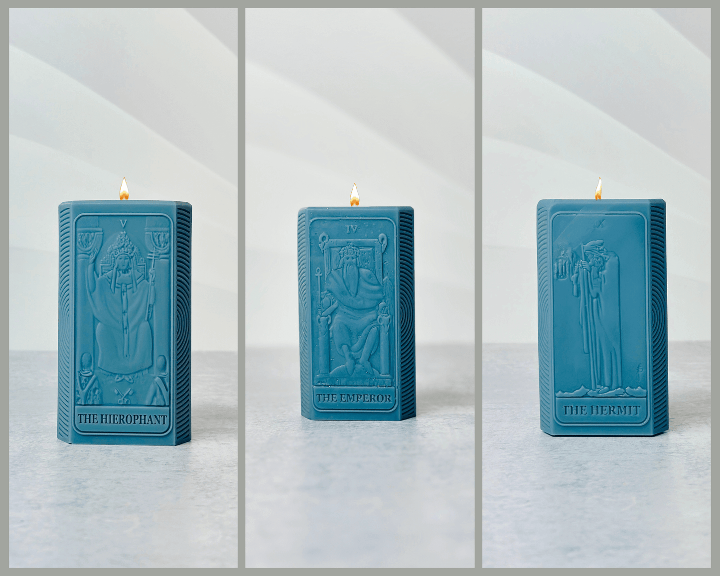 Three blue spiritual candles featuring The Hierophant, The Emperor, and The Hermit designs.