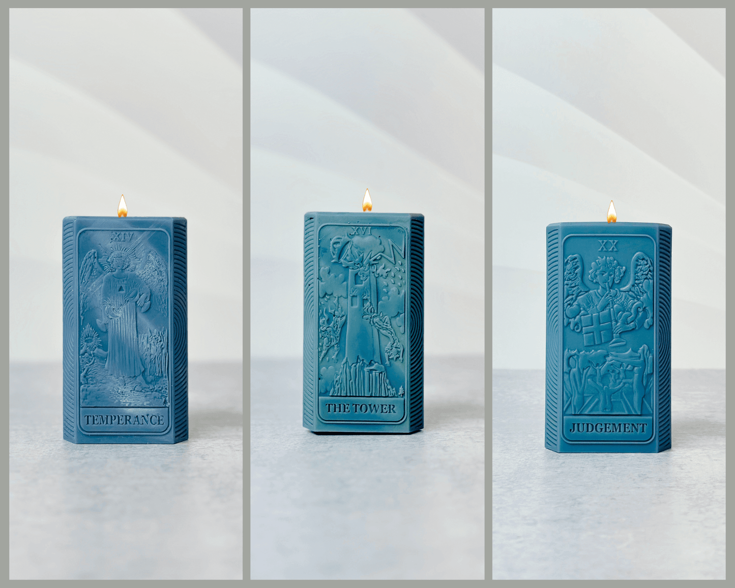 Three teal candles featuring Tarot card designs: Temperance, The Tower, and Judgement with lit wicks.