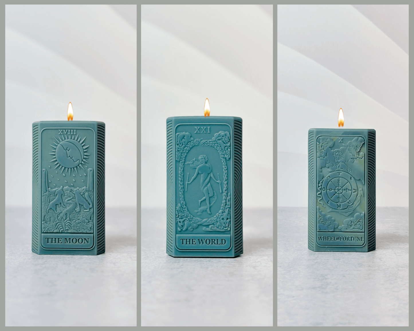 Handcrafted teal candles featuring tarot card designs: The Moon, The World, and Wheel of Fortune.