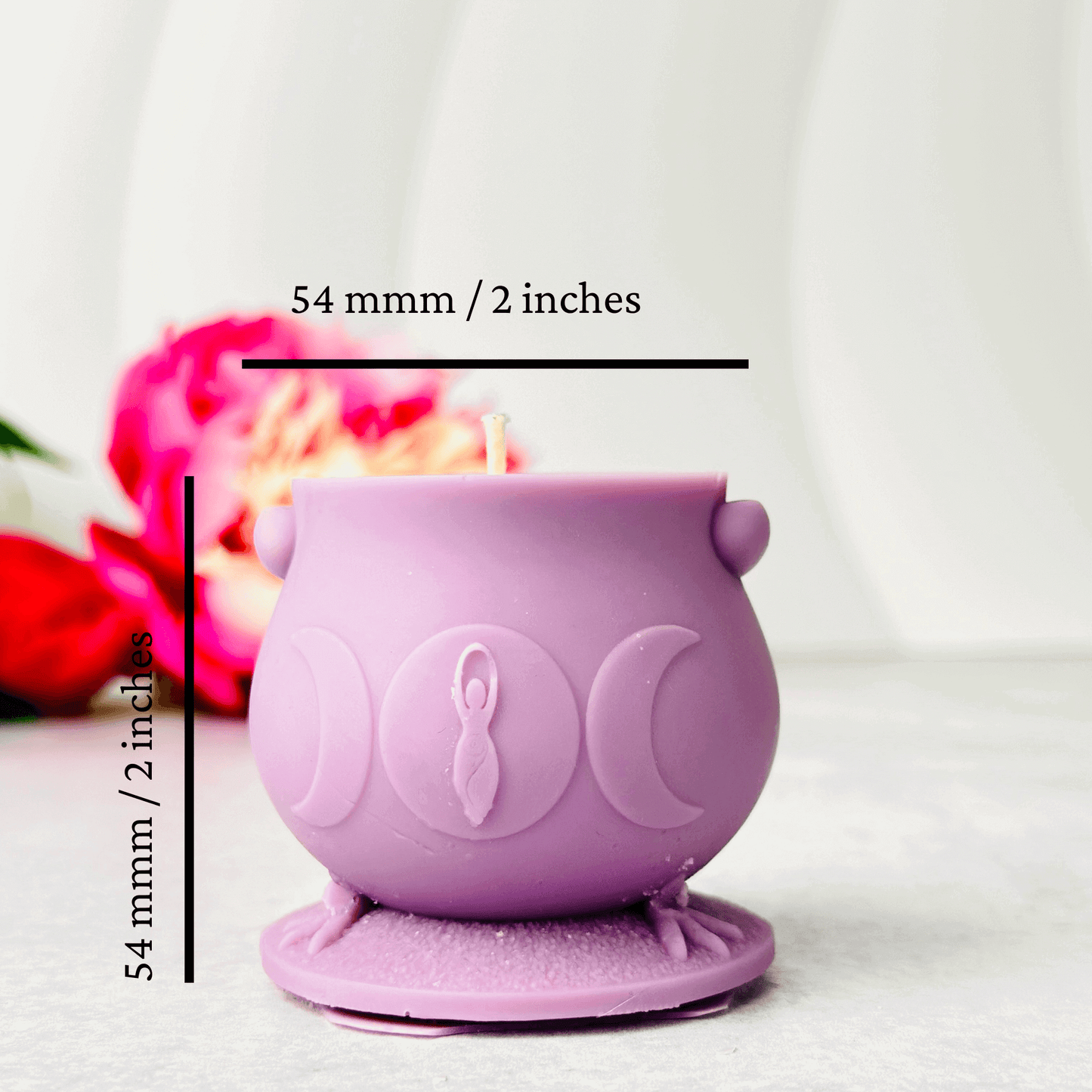 Unique purple silicone cauldron mold for candles, measuring 54 mm, with subtle witchcraft design details.