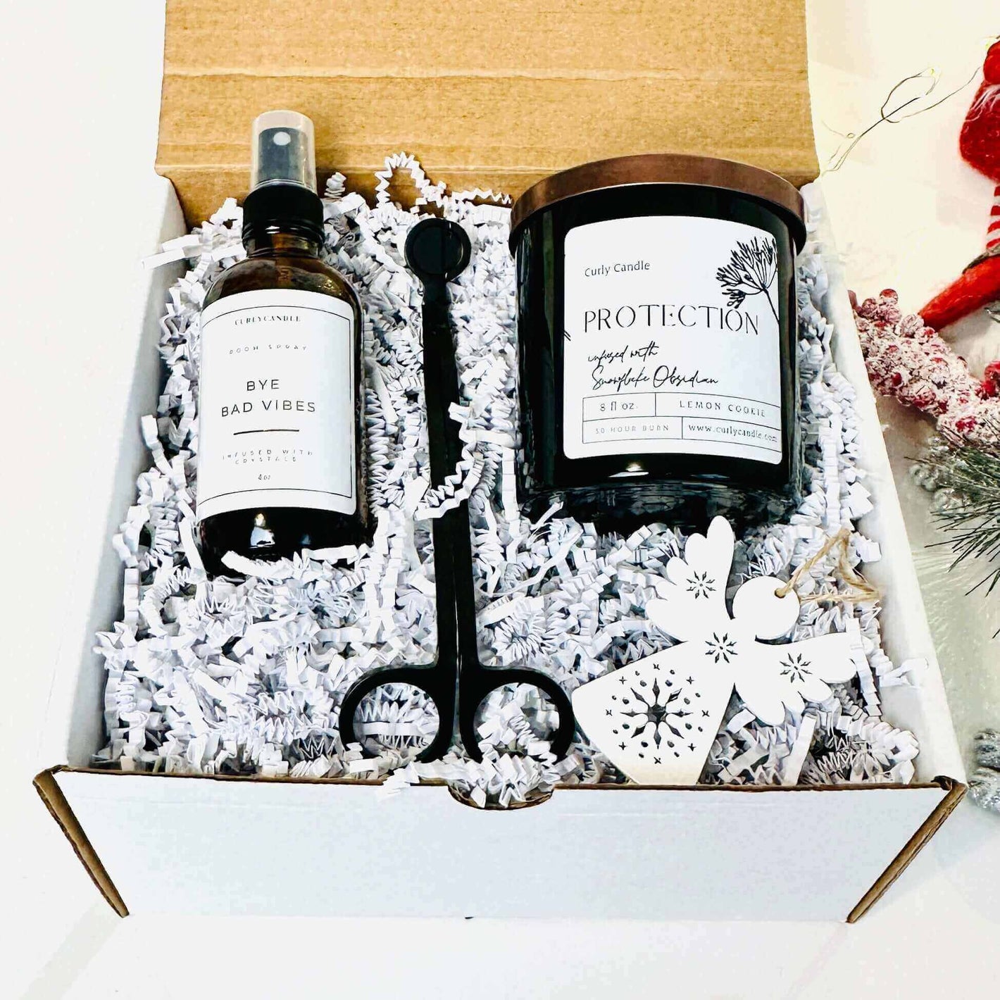 Personalized self-care gift set including a soy candle, spray, and accessories in a stylish box.