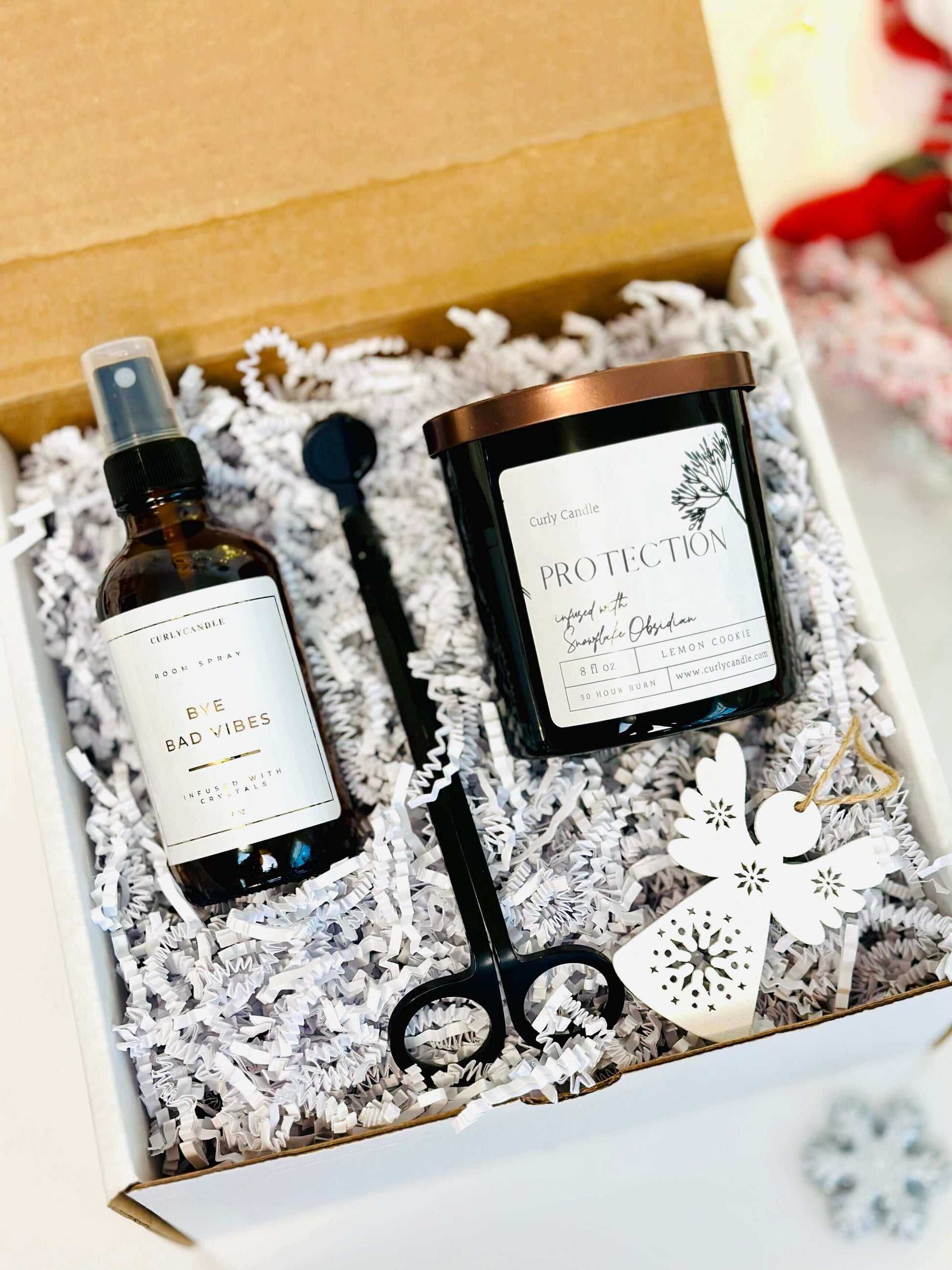 Personalized self-care gift set featuring a candle, spray, and accessories in a cozy box.