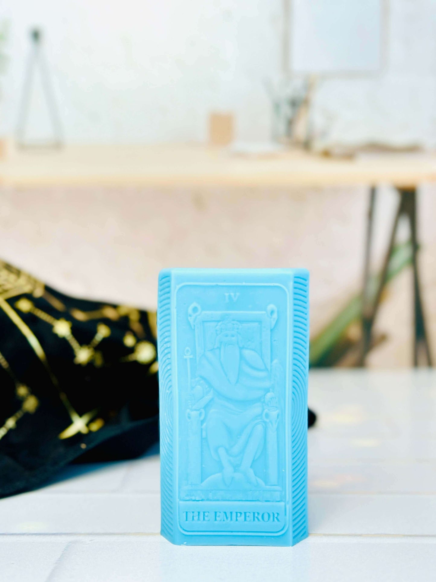 Blue silicone mold of the Emperor tarot card for crafting unique spiritual candles.