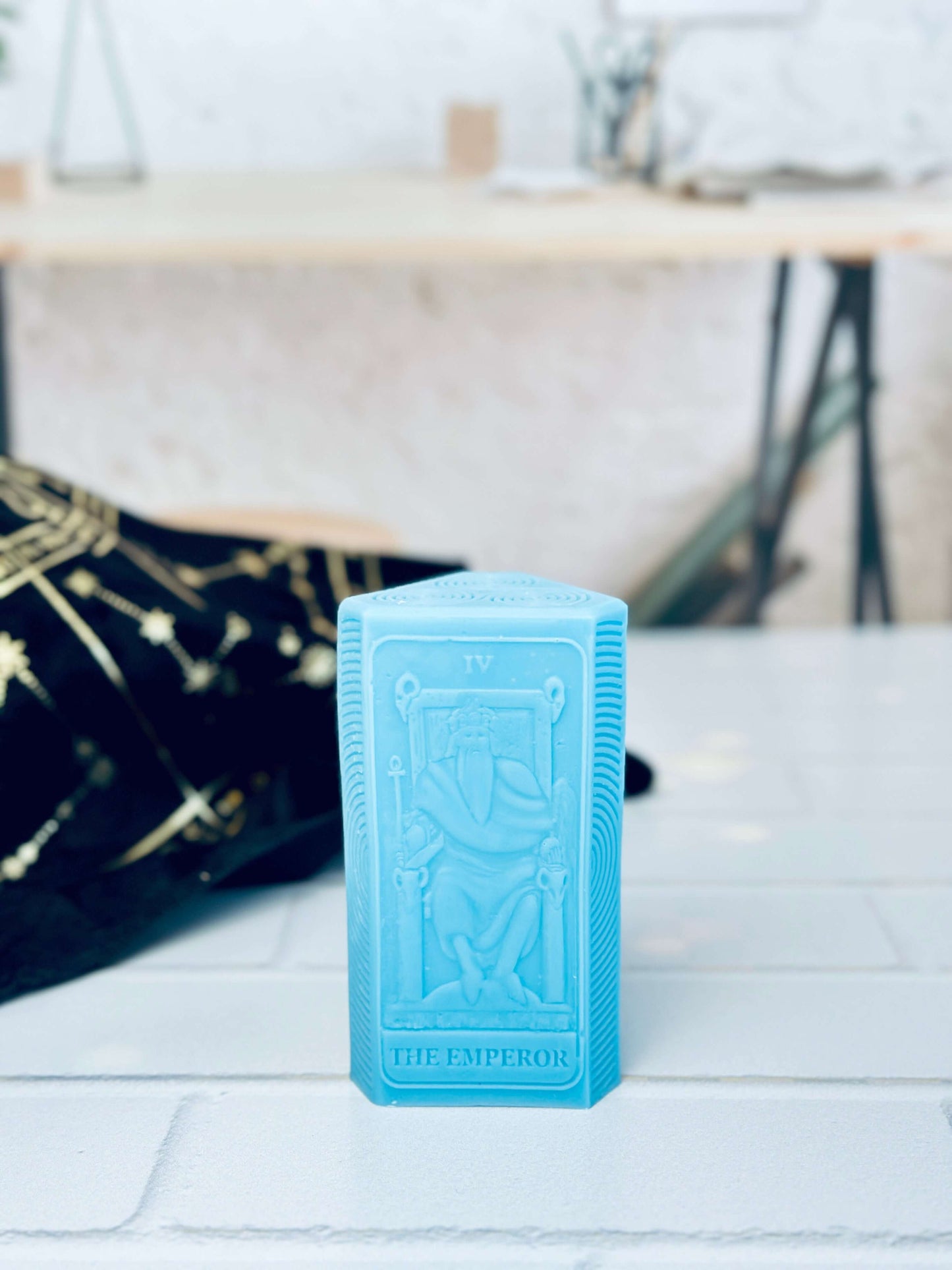 Blue silicone mold of the Emperor tarot card for crafting unique spiritual candles.