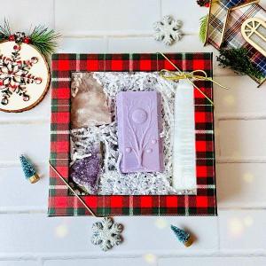 Moon Phases Spiritual Gift Set featuring a soy candle, selenite, and crystals in festive packaging.