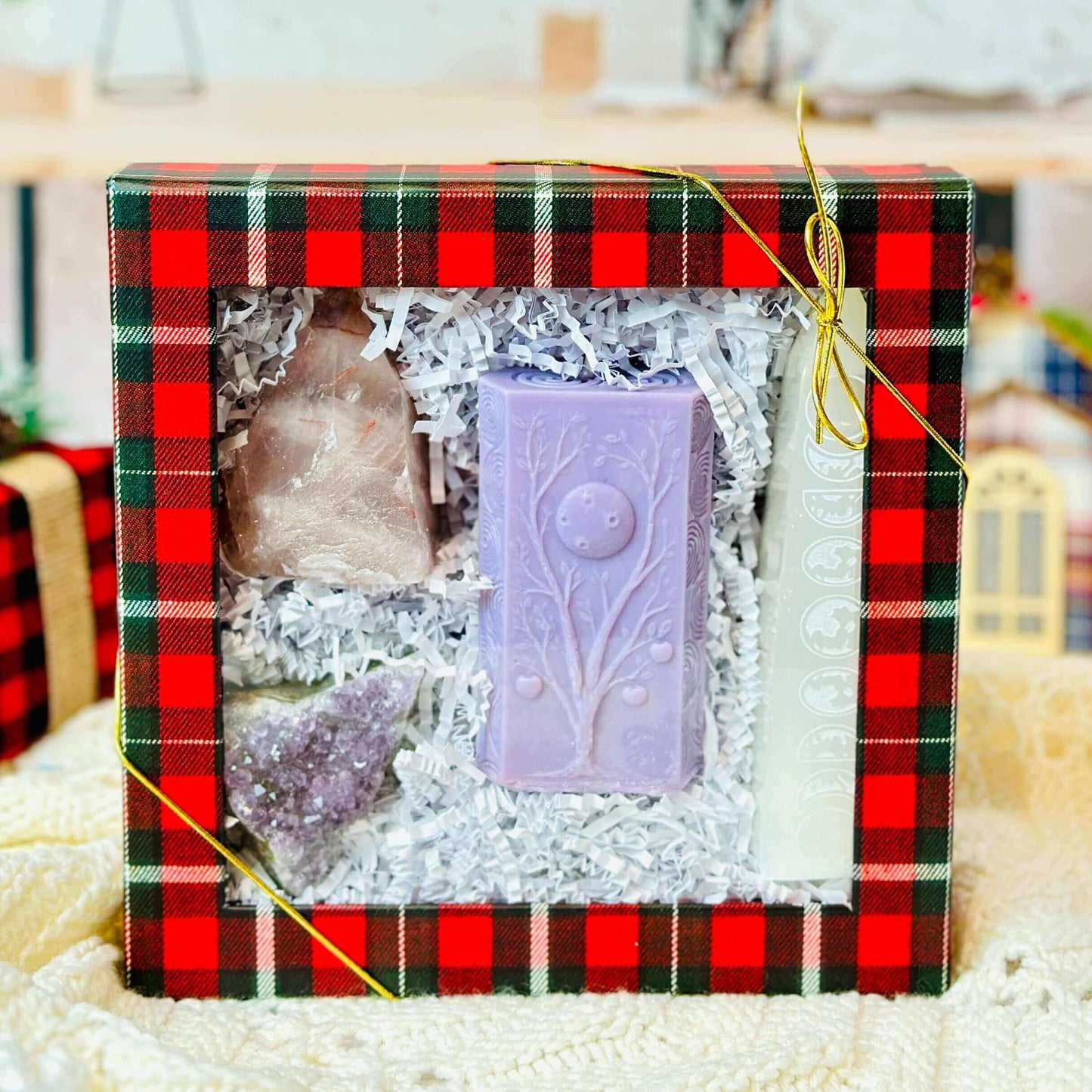 Moon Phases Spiritual Gift Set with purple soap, crystals, and candle in a festive gift box.