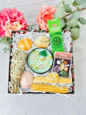 Chakra Balancing Gift Box Set with soy candle, crystals, sage, and Palo Santo for energy healing.