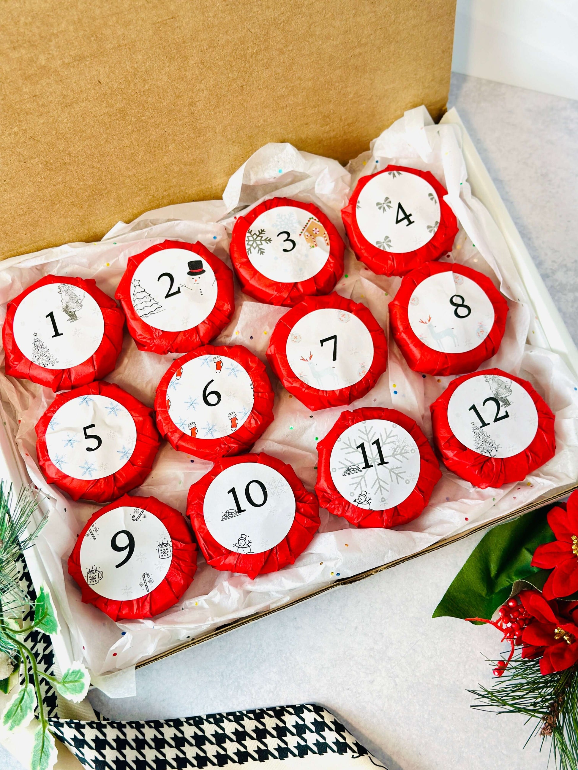 Bookish Candles Advent Calendar with 12 red wrapped candles numbered for each day of December.