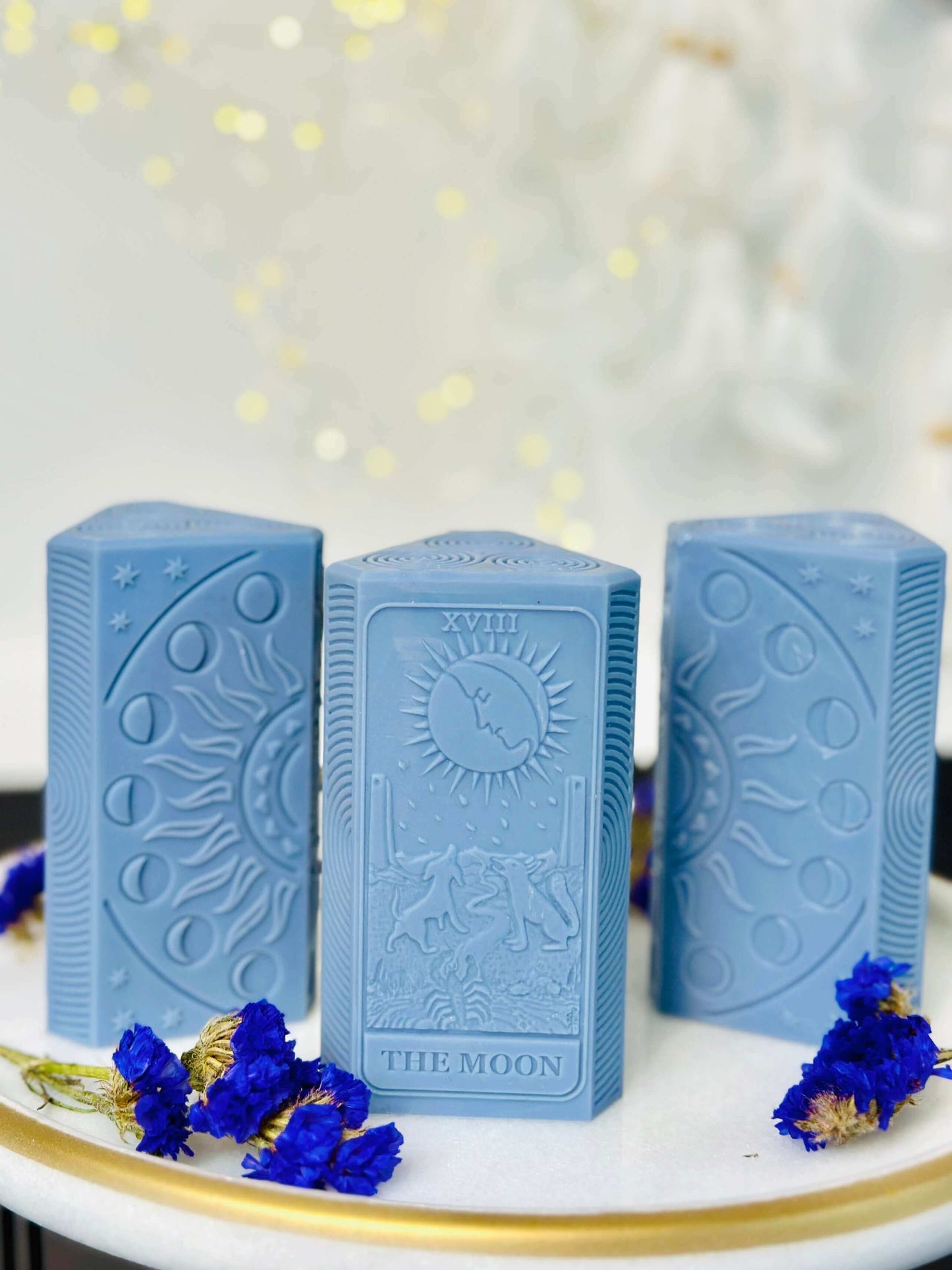 Moon phases silicone candle mold featuring detailed tarot card designs and an illuminated candle.