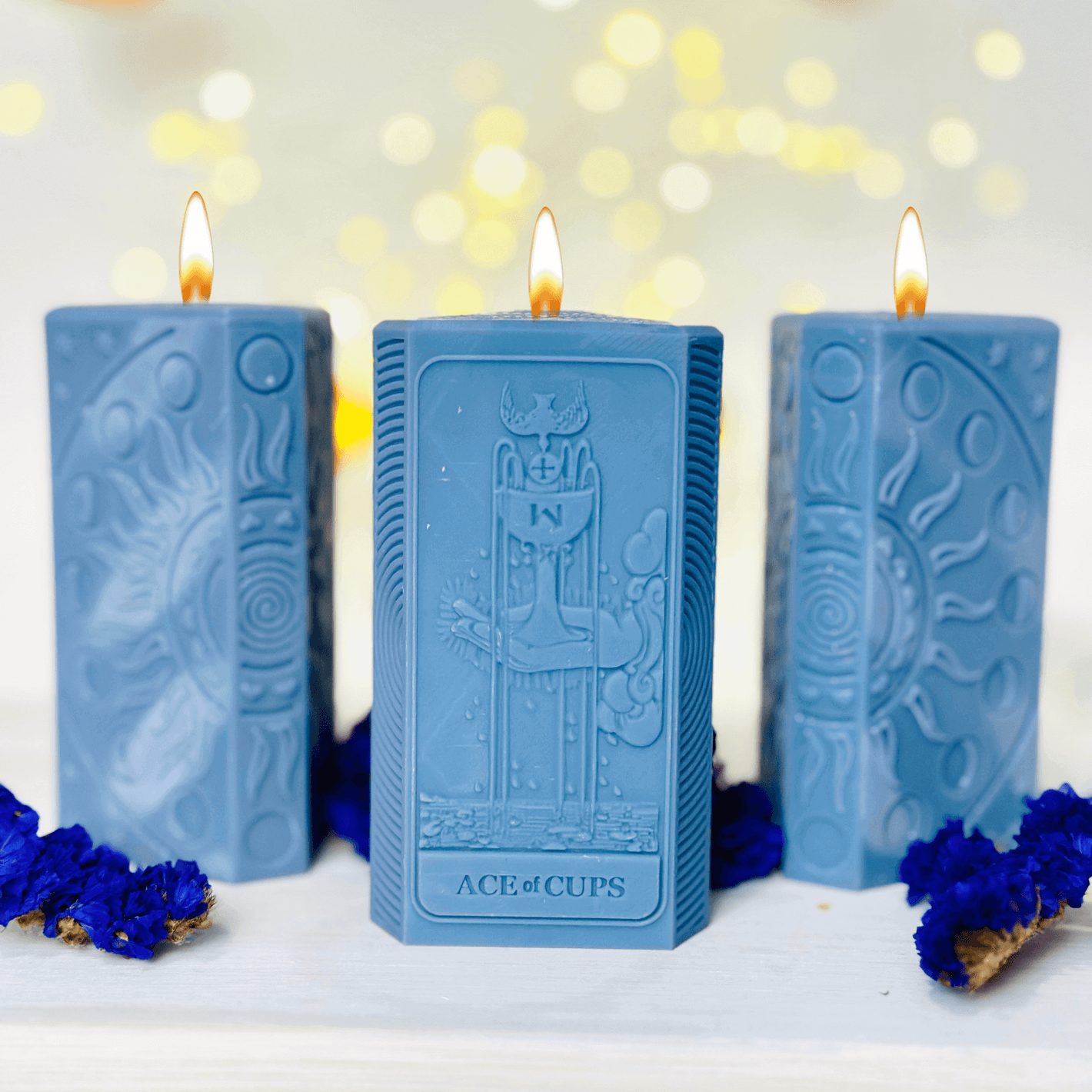 Ace of Cups tarot candle mold featured in a blue candle set with moon phases and flame accents.