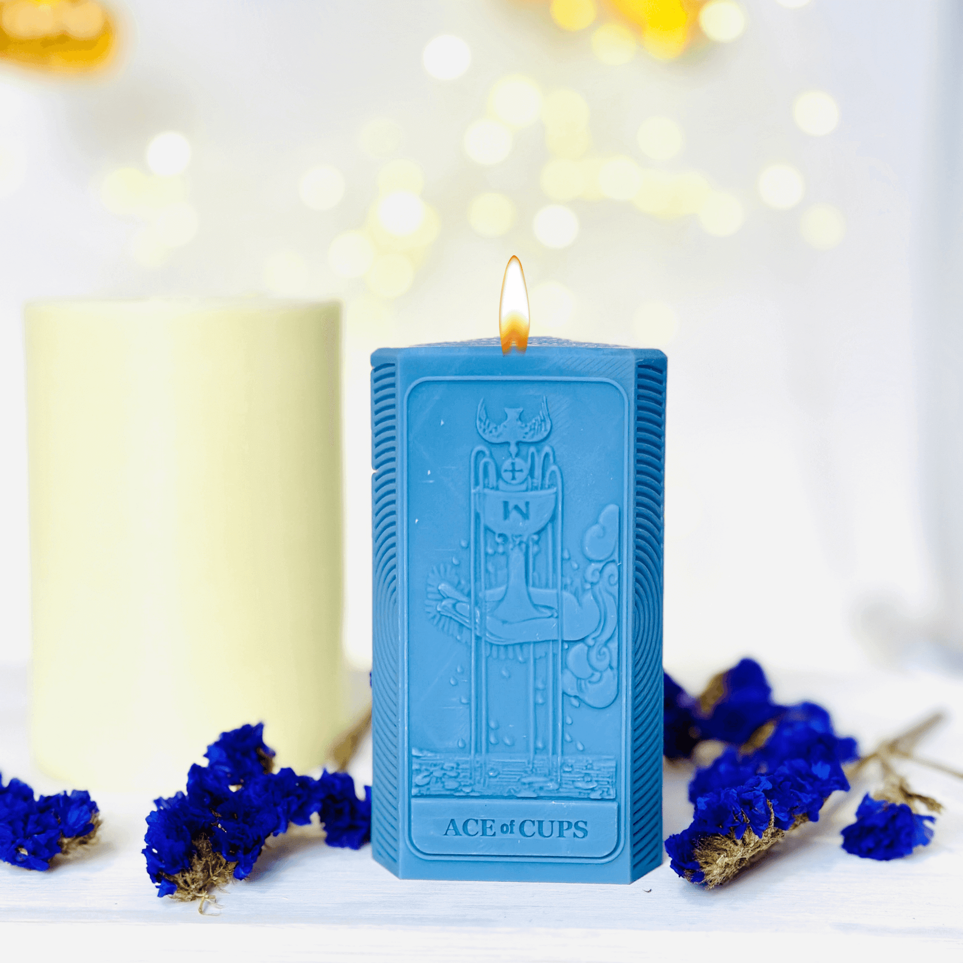 Ace of Cups tarot candle mold featured in a blue candle set with moon phases and flame accents.