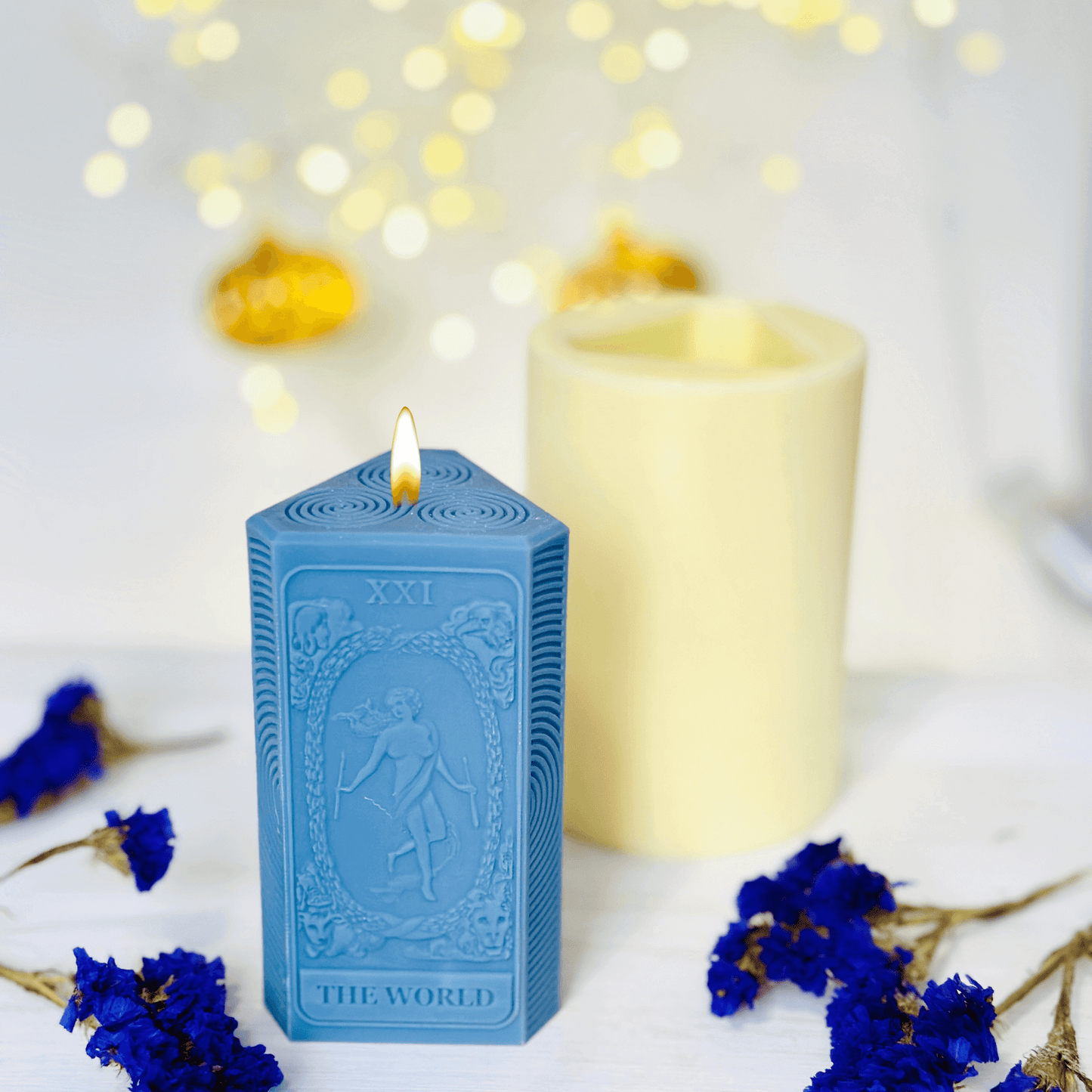 World tarot candle mold showcasing blue silicone candles featuring The World tarot card design.