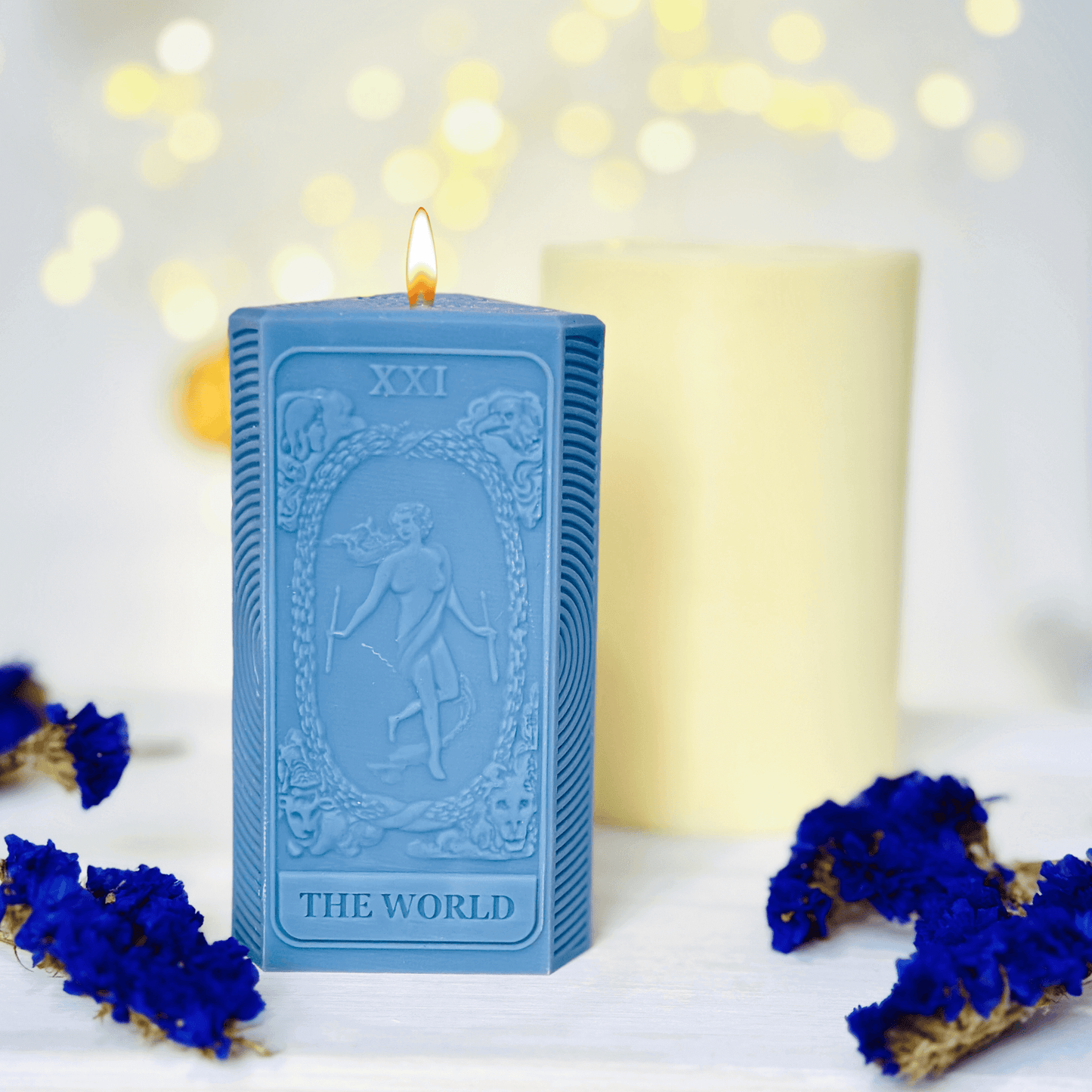 World tarot candle mold showcasing blue silicone candles featuring The World tarot card design.