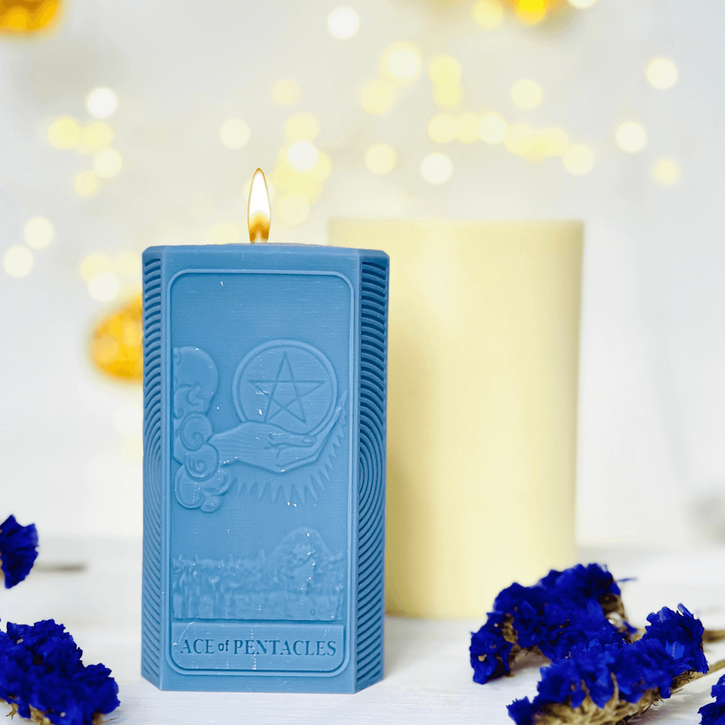 Ace of Pentacles Candle Mold - three blue spiritual candles showcasing sun and moon designs.