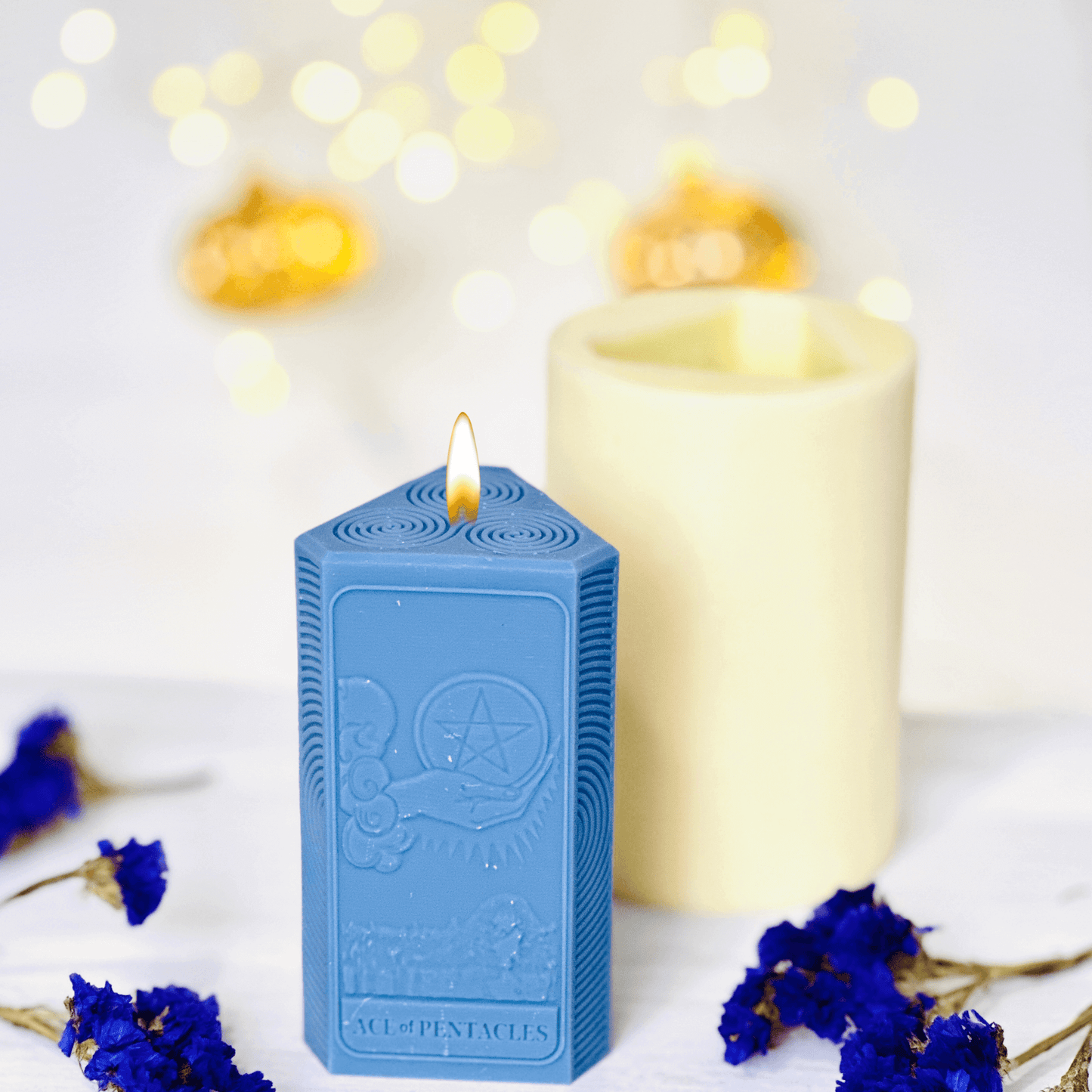 Ace of Pentacles Candle Mold - three blue spiritual candles showcasing sun and moon designs.