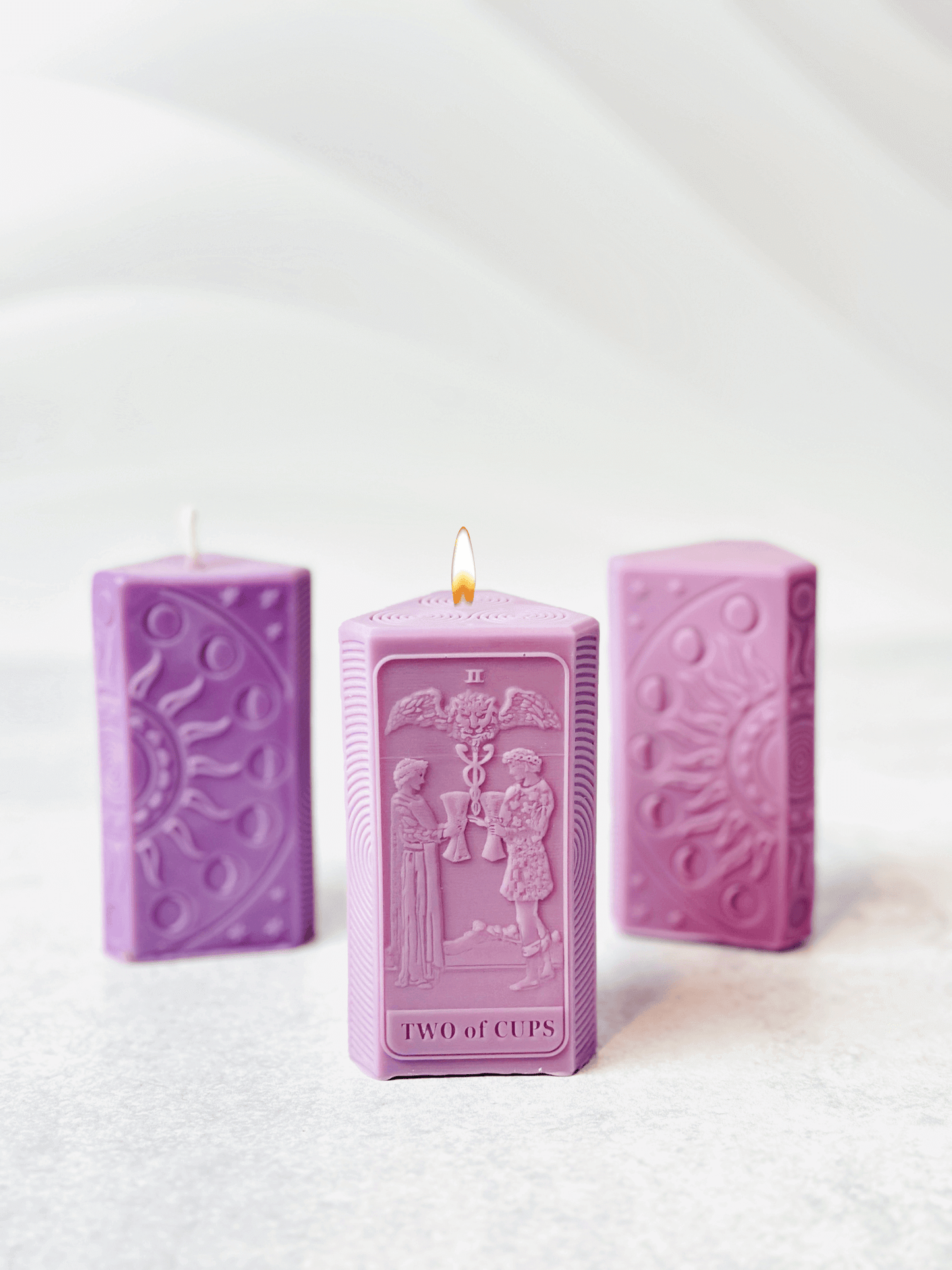 Two of Cups tarot card candle mold in purple, featuring two figures and moon phases, perfect for spiritual crafting.