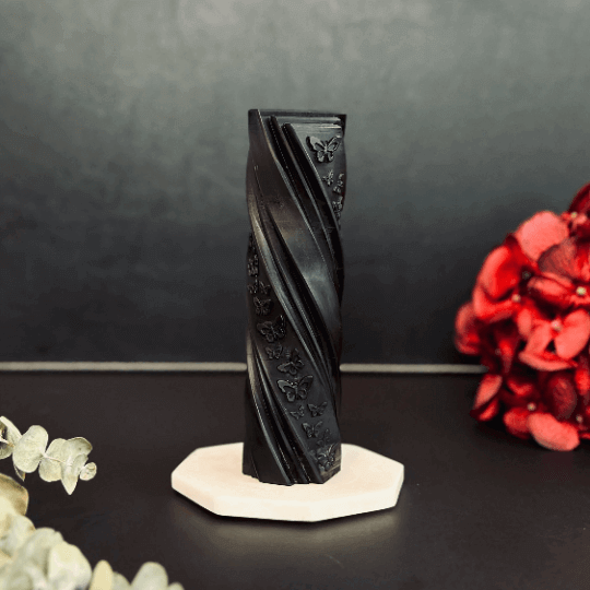 Butterfly pillar candle mold creating a vibrant  pillar candle with butterfly designs and decorative flowers.