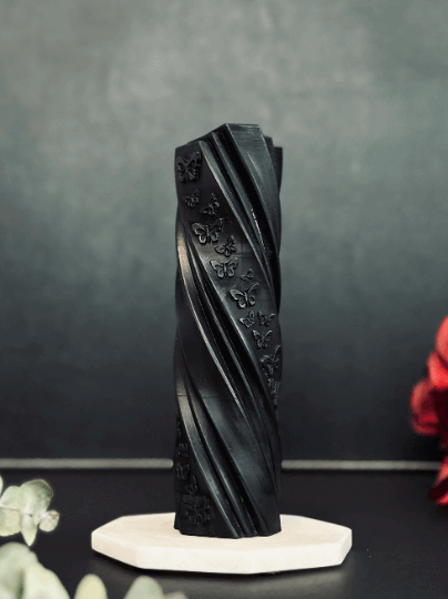 Butterfly pillar candle mold creating a vibrant  pillar candle with butterfly designs and decorative flowers.