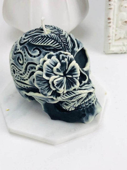 Gothic skull candle with floral designs, perfect for Halloween decor. Durable silicone mold essential for intricate candle crafting.