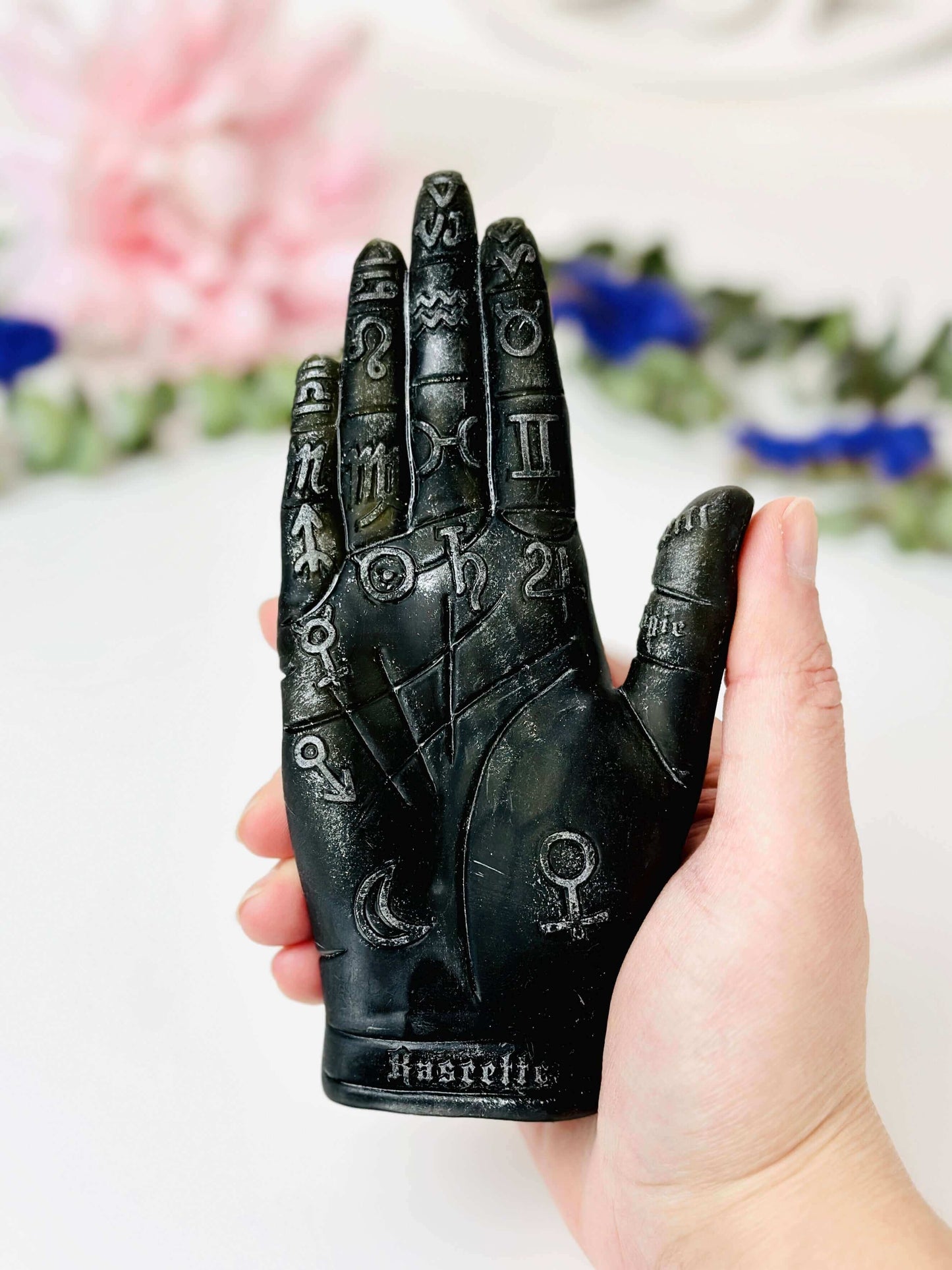 Palmistry Hand Silicone Mold held in hand, featuring astrological symbols for candle making and crafting.
