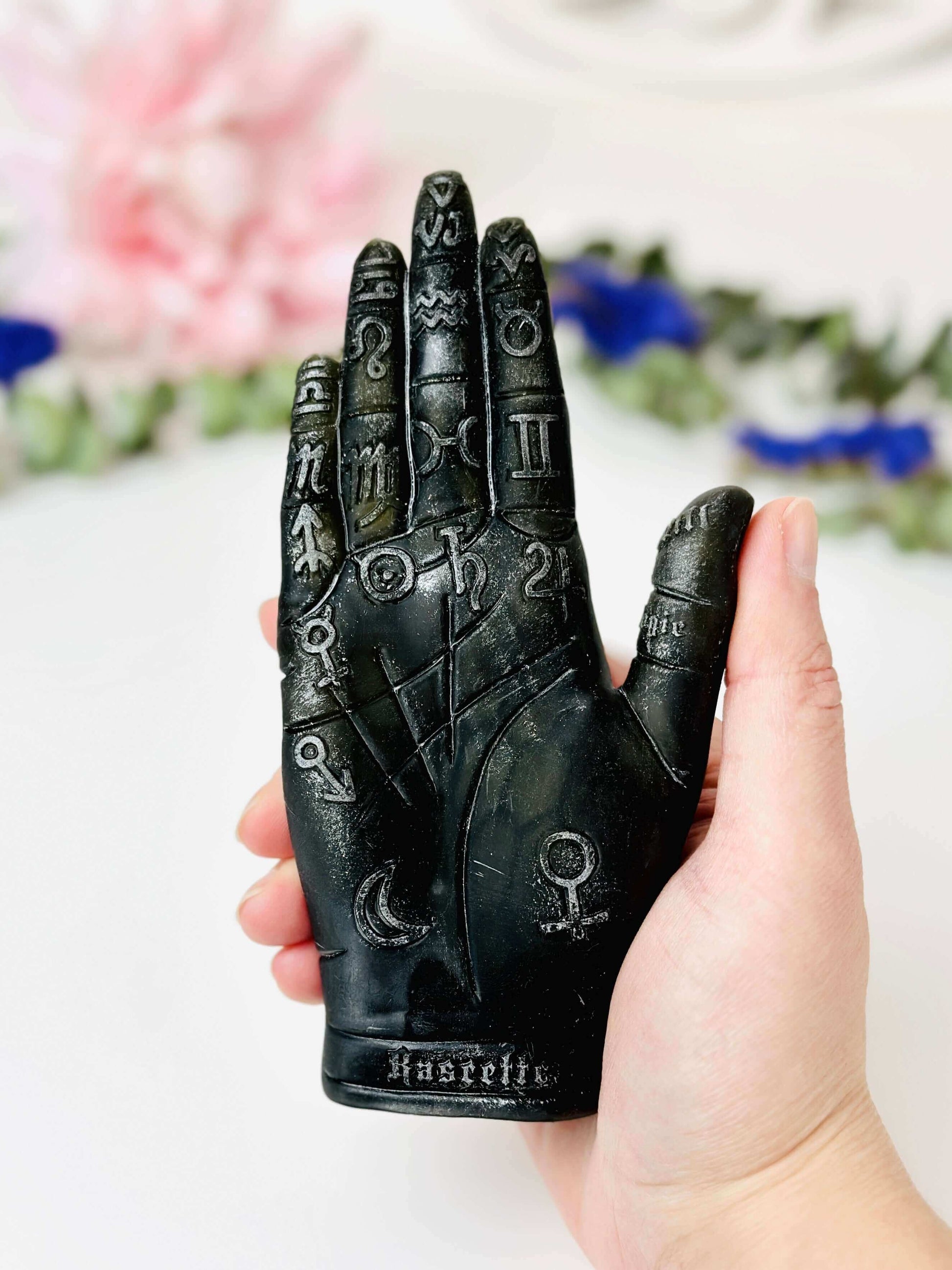 Palmistry Hand Silicone Mold held in hand, featuring astrological symbols for candle making and crafting.
