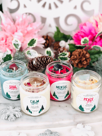Manifestation candle with herbs & crystals