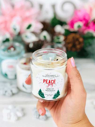 Manifestation candle with herbs & crystals