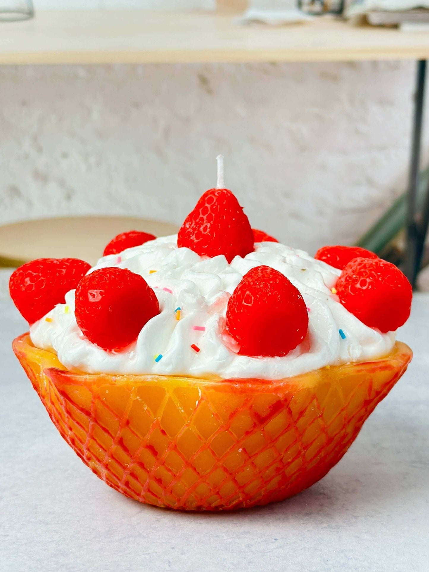 Handcrafted strawberry dessert candle made using a silicone mold, showcasing vibrant red strawberries and detailed decoration