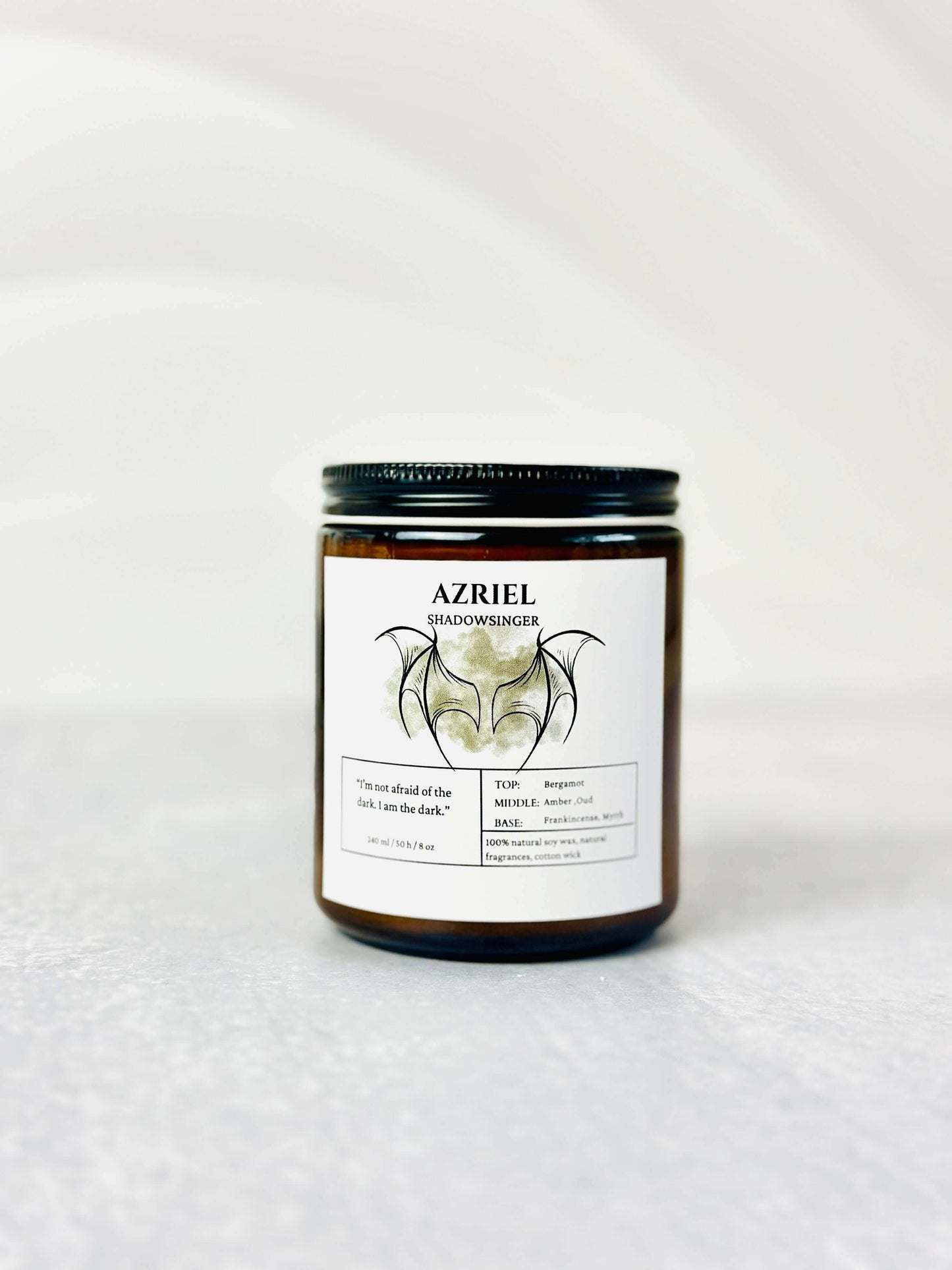 Azriel candle inspired by ACOTAR with dark amber and musk scent in a decorative jar