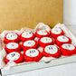 Bookish Candles Advent Calendar 2025 featuring 12 red-wrapped candles in a gift box for Christmas.