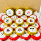 Bookish Candles Advent Calendar with gold tins and numbered candle labels for a festive holiday experience.