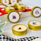 Bookish Candles Advent Calendar featuring colorful gold tins and unique scents for a festive holiday experience.