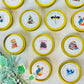 Bookish Candles Advent Calendar featuring 12 unique scented candles in gold tins for festive celebrations.
