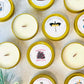 Bookish candles advent calendar in gold tins, showcasing unique scents for a festive holiday experience.